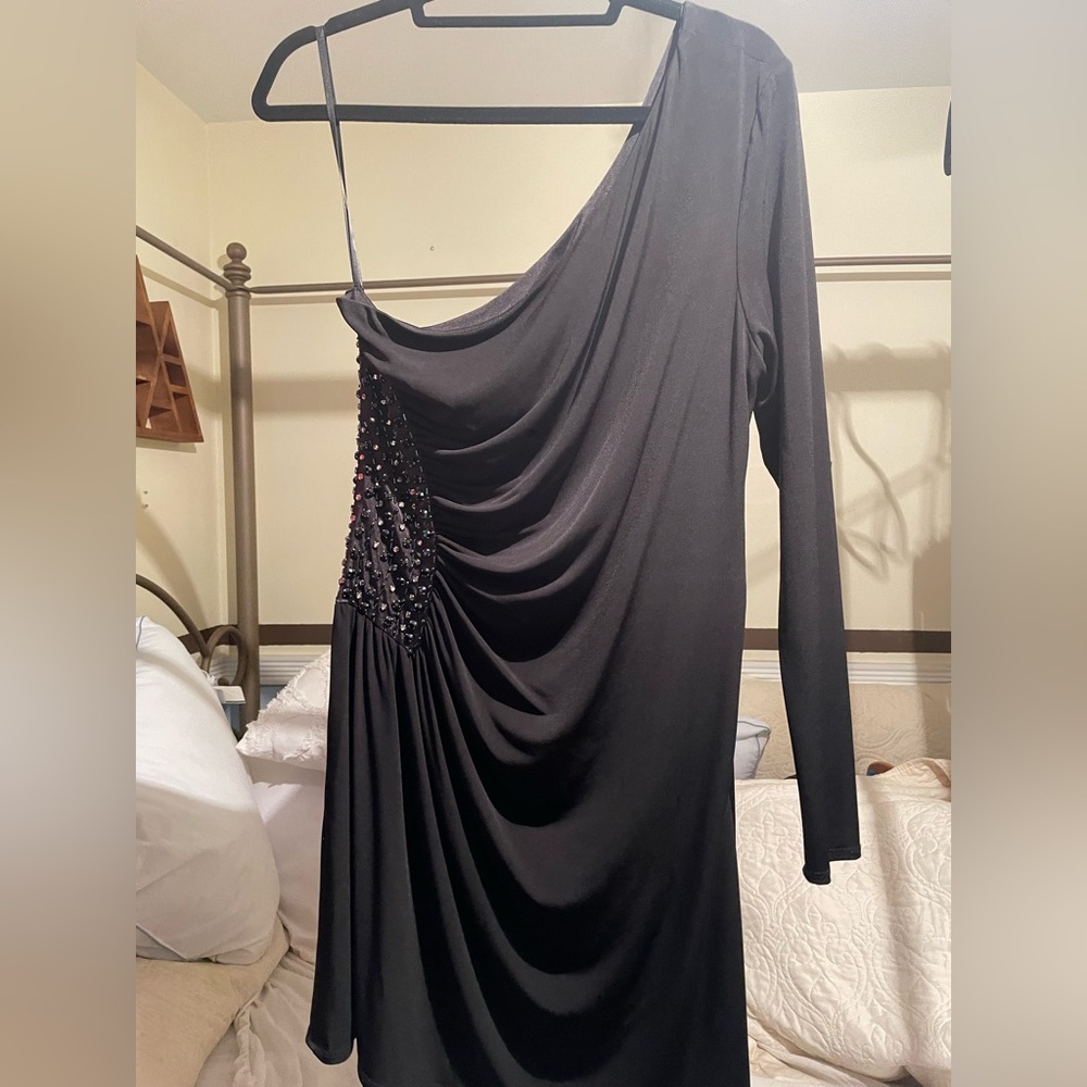 One sleeved black dress with beading